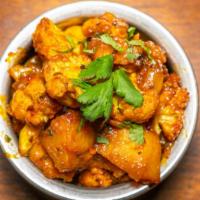 Aloo Gobi · Boiled potatoes cooked with cauliflower Flores, tomatoes and onion