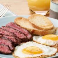 Steak And Eggs  · Grilled marinated flank steak , fried eggs, potato hash and house steak sauce