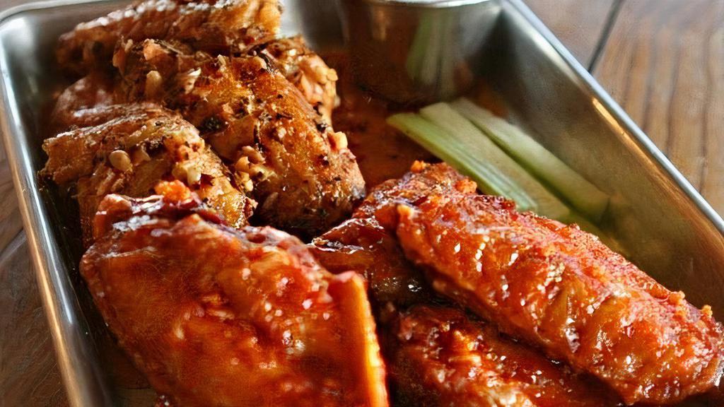 Wings · 5 Crispy wings tossed with your choice of wing spices or sauce.