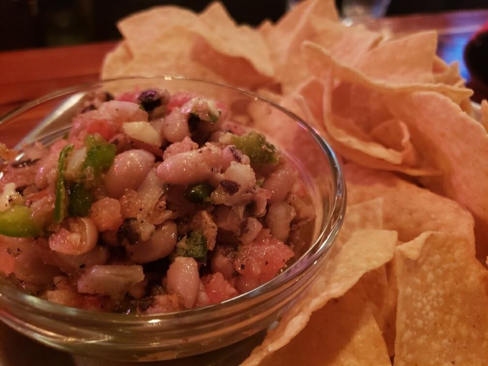 Neighbor'S Caviar · house-made dip with tomato, bell pepper, black-eyed peas, onion & basil-lime vinaigrette.  served with tortilla chips.