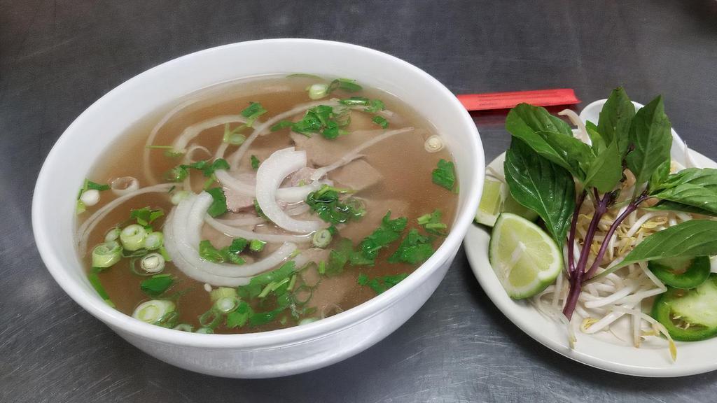 Beef Pho Soup · Served with bean sprout, cilantro, basil, lime, jalapeno and YOUR CHOICE OF ONE KIND OF PROTEIN :  rare eye round steak, well done brisket, well done flank, fat brisket, tripe, tendon, meat ball, shrimp, chicken or vegetables and soft tofu.