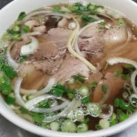 Beef Noodle Soup Pho Combo · Served with bean sprout, cilantro, basil, lime, jalapeno   rare eye round steak, well done b...