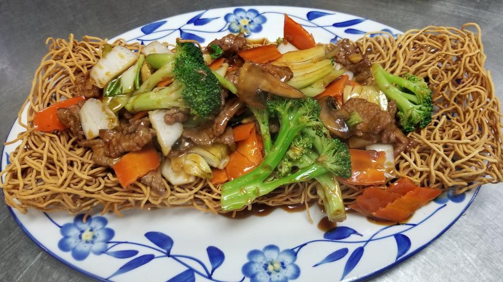 Stir-Fry Flat Rice Or Egg Noodle With Beef And Vegetables · Beef  and fresh vegetables stir fry with a tasty brown souce your choice of crispy or soft  noodles.