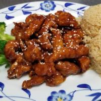 Sesame Chicken · Stir-fry battered chicken with a tangy, sweet sauce, lightly topped with sesame seeds.