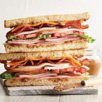 Turkey Bacon Ham Stack · oven-roasted turkey, bacon, pecan wood smoked ham, tomatoes, leaf lettuce, Swiss and cheddar...