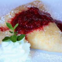 White Choc. Raspberry · White chocolate mousse and sliced bananas topped with powdered sugar and raspberry compote