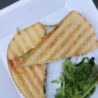 Caprese Panini · Basil Pesto Mayo spread on both slices of bread with Fresh Basil, Roasted Tomatoes and Fresh...
