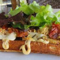 Tuscan Waffle · A waffle drizzled with Harissa Aioli and topped with Fresh Mozzarella, Roasted Tomatoes, Scr...