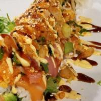 Special Roll  · Raw, Spicy. Avocado, cream cheese, jalapeno assorted fish, top with three kinds of fish, plu...