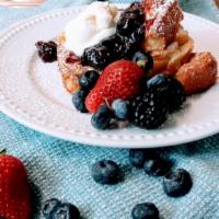 Triple Berry Jam French Toast · Traditional french style toast, topped with our awesome tripple berry jam, fresh cream and f...