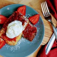 Strawberry Jam French Toast · Traditional french style toast, topped with our house made strawberry jam, fresh vanilla cre...