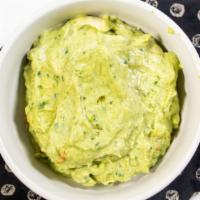 Avocado Hummus · Puree chickpea-sesame dip blended with fresh avocado, olive oil, lemon juice, served with pi...