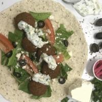 The Greek Falafel · Tortilla, Falafel, Lettuce, Tomato, Olives, Feta Cheese & Tzatziki Sauce
