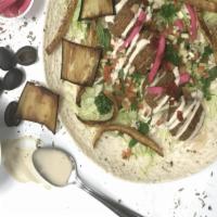 The Supreme Falafel · Falafel, Hummus, Tomato Salsa, Parsley, Mint, Pickles, Eggplant, fried potato, Turnips & Spi...