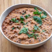 Dal Makhani · Rich and creamy black lentils simmered on slow fire. NOT SERVED WITH RICE OR NAAN.