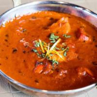 Lamb Tikka Masala · Lamb cooked in a creamy onion tomato masala sauce. NOT SERVED WITH RICE OR NAAN.