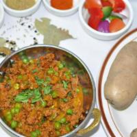 Keema Mutter · Minced lamb with green peas cooked in masala sauce. NOT SERVED WITH RICE OR NAAN.