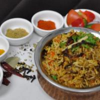 Lamb Biryani · Long-grain basmati rice cooked with lamb, flavored with fresh herbs and spices
