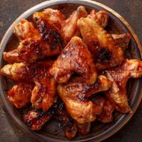 Bbq Wings (6 Pieces) · Crispy, fried wings glazed with our smoky, sweet and tangy BBQ sauce.