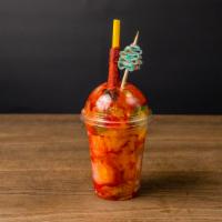 Mango Ice (16 Oz) · Mango shaved ice topped with gummies and pickles.