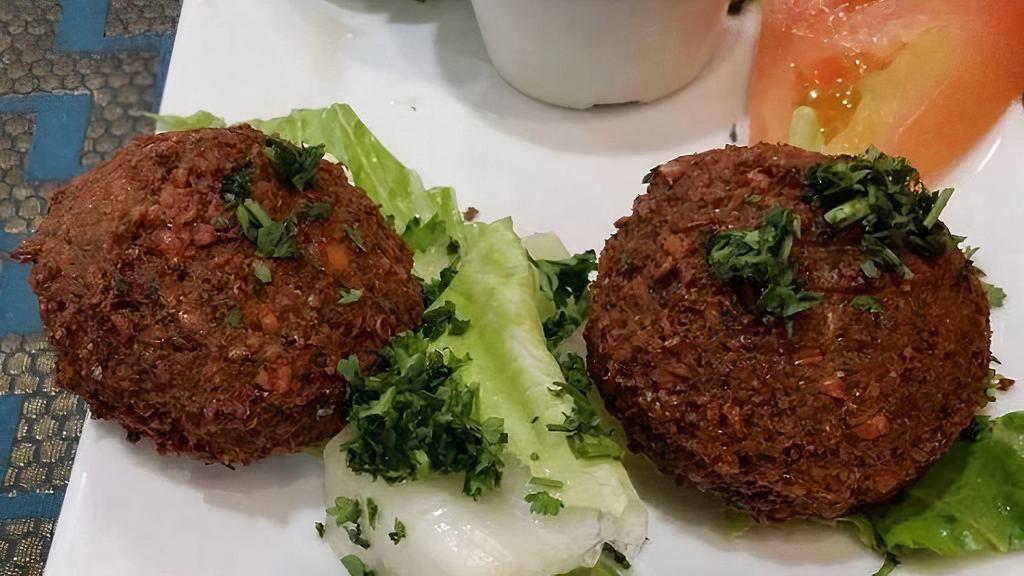 Falafels · Four golden brown spiced chickpea patties, fried to perfection, served with tzatziki sauce.