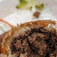 Fried Kibbeh · Three homemade burghul (cracked wheat) hand-filled with beef, onions, and middle Eastern spi...