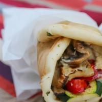 Eggplant Gyro Wrap · Grilled eggplant, lettuce, tomatoes, onions, and tzatziki sauce wrapped in fluffy pita bread.