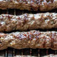 Koobideh (Kofta) Wrap · Skewer of kabab wrapped in homemade tannour bread with garlic sauce, hummus, tomato, lettuce...