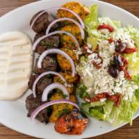 Kabob Combination · Your choice of two skewers joojeh chicken, chenjeh beef, or koobideh kabab, served with gril...