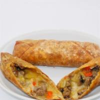 Philly Cheesesteak Egg Roll Meal · Steak, fire-grilled sweet peppers, red onions, and provolone. Paired with our queso blanco s...