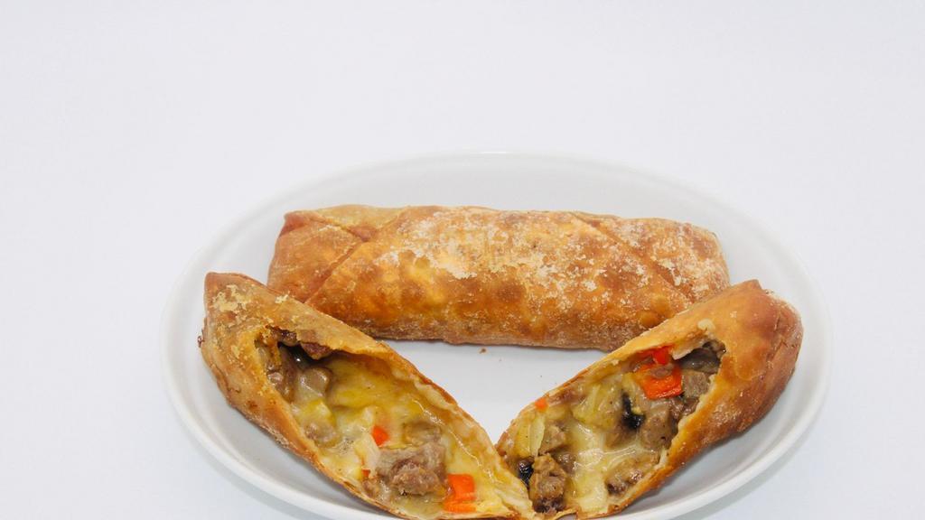 Philly Cheesesteak Egg Roll Meal · Steak, fire-grilled sweet peppers, red onions, and provolone. Paired with our queso blanco sauce. Includes three egg rolls, fries, and a fountain drink or tea.