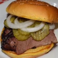 Sliced Beef · 1/3 of a pound of our slow hickory smoked brisket on a whole egg bun, sauce on the side. Pic...