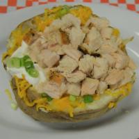 Loaded Baked Potatoes · Potatoes come with margarine, cheese, sour cream and chives on the potato, unless noted. Bar...