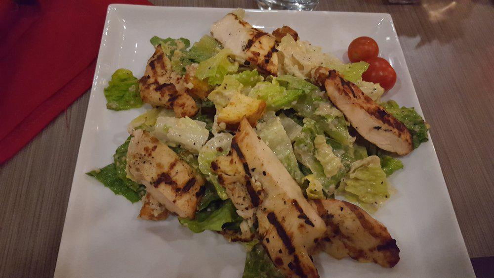 Caeser Salad · Romaine lettuce tossed in our caesar dressing with croutons and parmesan cheese.