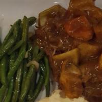 Southern Pot Roast  · Slow roasted with carrots and potatoes, topped with savory beef gravy.