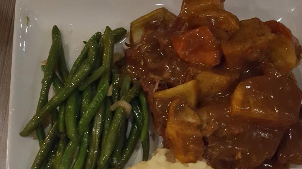 Southern Pot Roast  · Slow roasted with carrots and potatoes, topped with savory beef gravy.