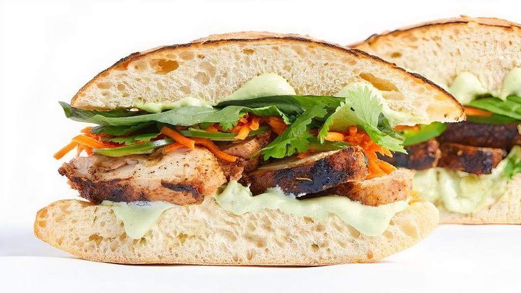 Chicken Banh Mi · Antibiotic-free blackened chicken thigh, pickled carrot, cilantro, basil, jalapeno, lemongrass aioli on ciabatta. Served with a side of house-seasoned kettle chips.