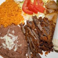Milaneza Plate · Breaded Beef Or Chicken Served With Rice & Beans