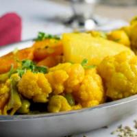 Navrattan Curry · Nine fresh vegetables cooked with a curry sauce. A classic dish. Veggie.