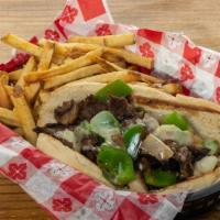 Philly Cheese Steak W/Fries · A fresh hoagie roll filled w/grilled sliced beef and sauteed mushrooms, onions, & green pepp...