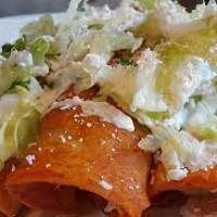 Enchiladas Mexicanas · 3 tortillas filled with Mexican cheese. Topped with fried potatoes and carrots. Served with ...