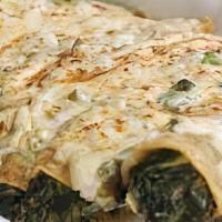 Spinach Enchiladas · 2 tortillas filled with chicken topped with sour cream sauce and cheese. Served with rice an...
