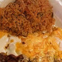 Combination Enchiladas · 1 cheese, 1 chicken, 1 beef enchilada topped with gravy chile and cheese. Served with rice a...