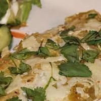 Anaheim Pepper Enchiladas · 2 tortillas filled with chicken and poblano peppers. Topped with sour cream sauce and cheese...