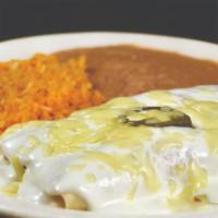 Sour Cream Chicken Enchiladas · Two enchiladas topped with sour cream sauce and jalapeños served with rice and refried beans.