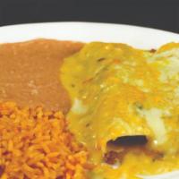 Chile Con Queso Beef Enchiladas · Two enchiladas topped with queso sauces served with rice and refried beans.