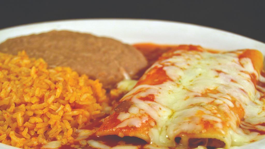Enchiladas Rojas · Two enchiladas topped with ranchero sauce served with rice and refried beans.