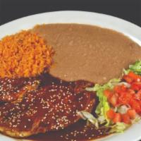 Pechuga Ranchera · A grilled chicken breast topped with ranchero sauce and Mozzarella cheese served with refrie...
