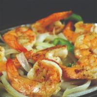 Camarones A La Plancha · Large shrimp grilled with onions and pepper served on a sizzling skillet, included toasted b...