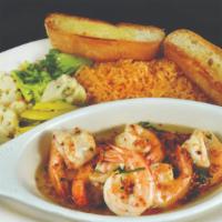 Camarones Al Mojo De Ajo · Large shrimp marinated in white wine, butter, and garlic; grilled and served with rice and m...